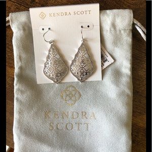 Kendra Scott silver drop earrings.